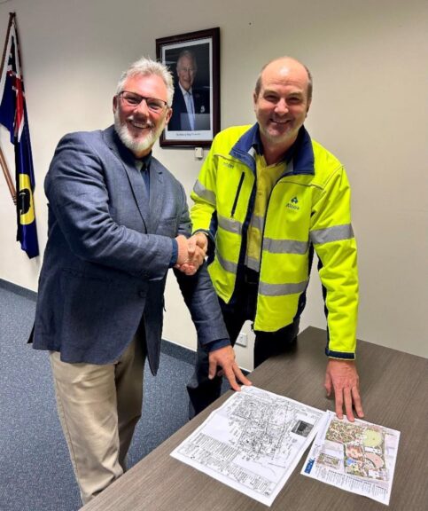 Shire of Waroona president Cr Mike Walmsley (L) and Alcoa Willowdale manager community relations Scott Hansen (R) seal the funding deal.
