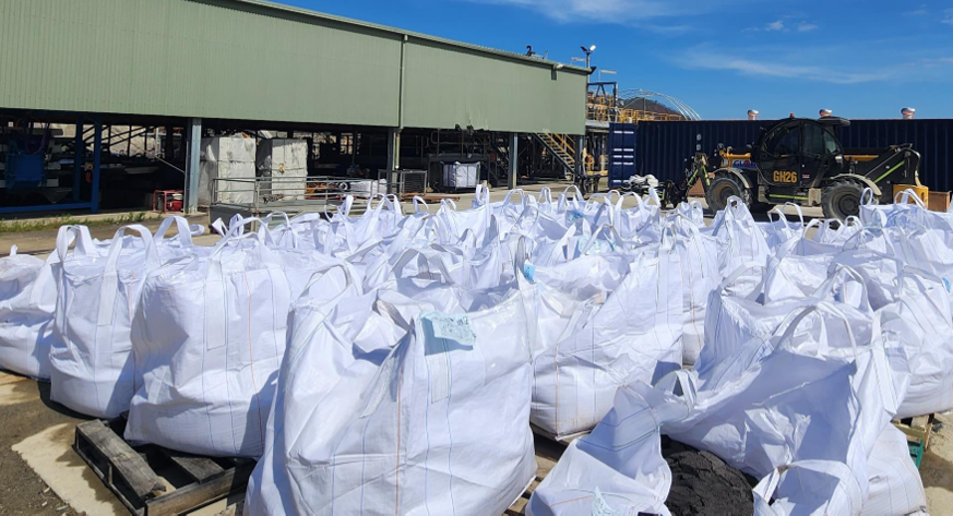 Bags of tungsten concentrate ready for transport.