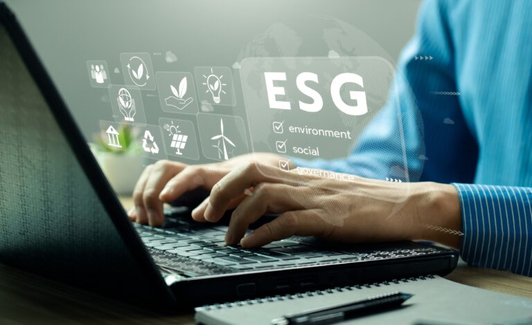 Man using computer to analyse ESG metrics.