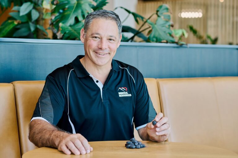 Mineral Resources chief executive, iron ore Chris Soccio with cold-bonded iron ore pellets.
