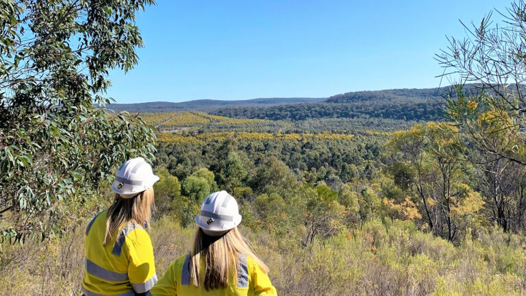 Ulan coal’s environment and community team overlooking the certified mine rehabilitation.