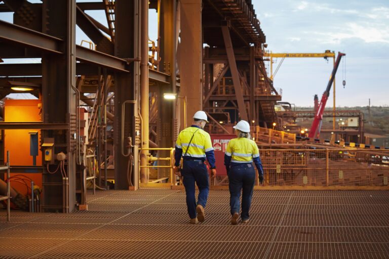 Two FMG workers at the Cloudbreak Mine.