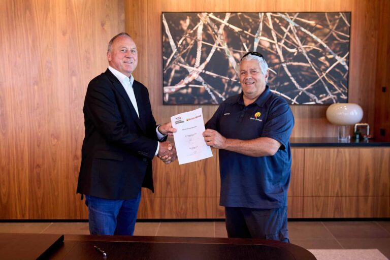 MinRes Managing Director Chris Ellison and Buru Rehab director George Todd at a contract signing ceremony at MinRes headquarters in Perth.