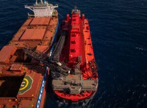 (Image source: Mineral Resources) MinRes transhipper loading Onslow iron’s first ore to a COSCO Shipping bulk carrier. 
