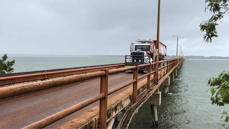 (Image source: Mineral Resources) The truck driving across the Weipa Mission Bridge.