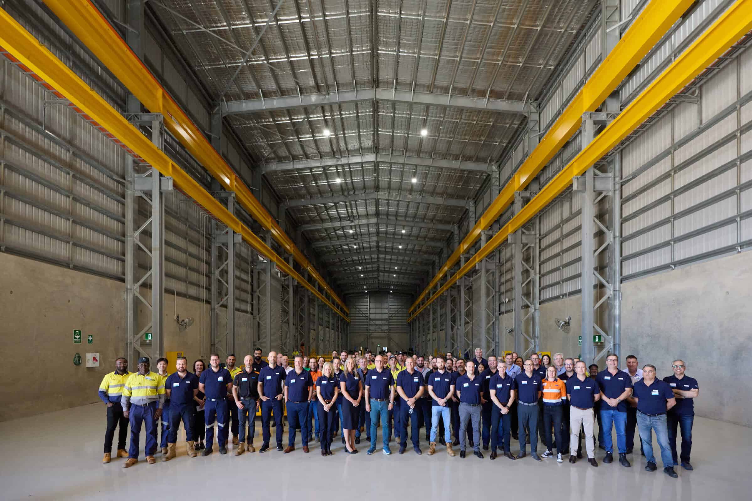Weir employees standing inside the brand new, expansive Port Hedland service centre.