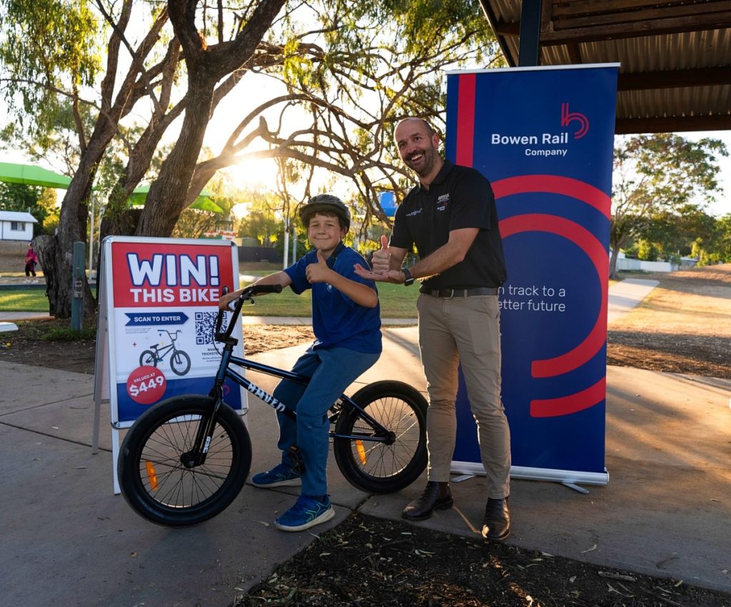 (Image source: Bravus Mining and Resources) (L-R) Nicolas, winner of the BRC BMX giveaway, with BRC general manager Brendan Lane