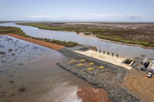 (Image source: BCI Minerals) Primary seawater intake and the pumps (the yellow rectangles on the rocks). 
