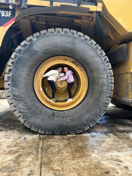 Zoe and Ruby Stiles exploring the CAT793 at the Premier Coal Family Fun Days.