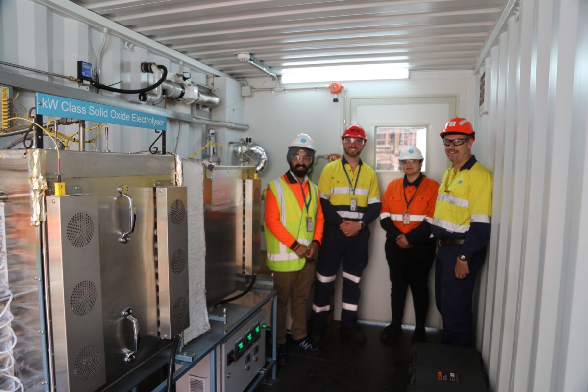 CSIRO’s Sarb Giddey and Gurpreet Kaur, BlueScope’s Shannon Ballard and Hadean Energy’s Chris Rowland with the SOE electrolyser at BlueScope’s Port Kembla, NSW, steel plant.