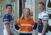 BRAVUS backs the Cowboys from pit to port (Image source: BRAVUS) North Queensland Toyota Cowboys players Jaxon Purdue and Jake Clifford with Bravus Head of Reputation Kate Campbell.